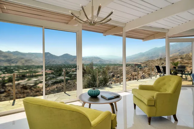 a large white bed in a white room