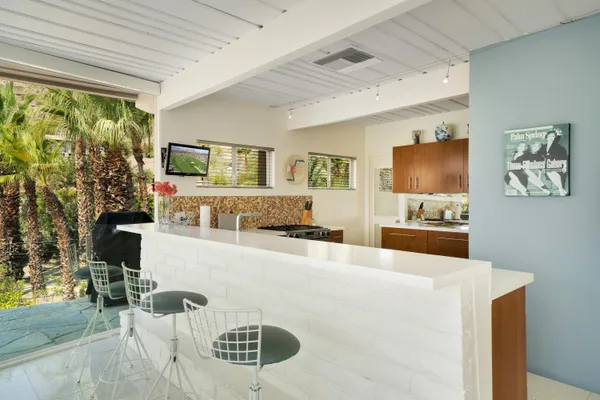 a kitchen with stainless steel appliances a stove and a sink