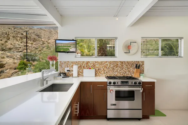 a kitchen with a stove and a sink