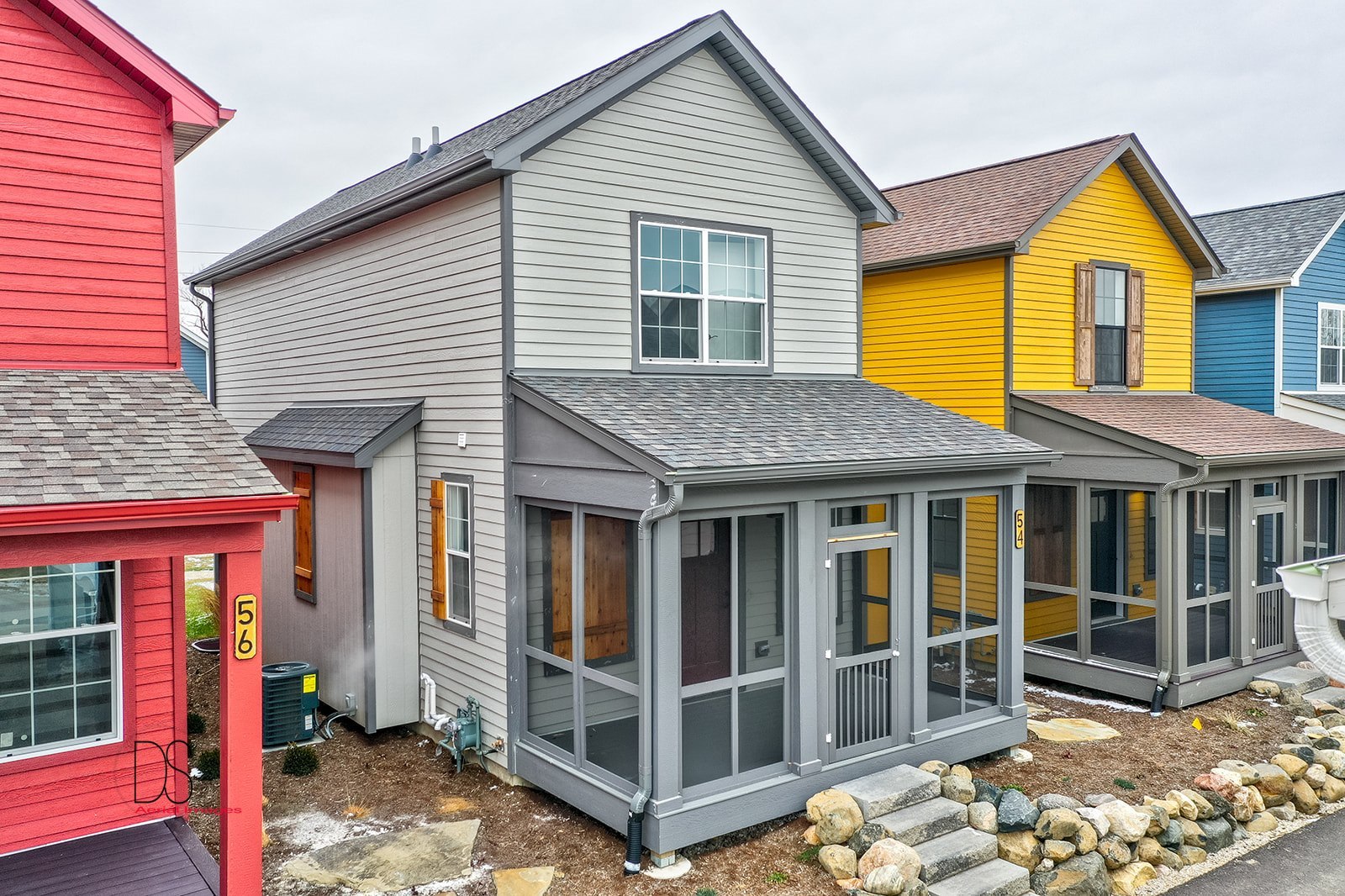 a view of brick house with large windows