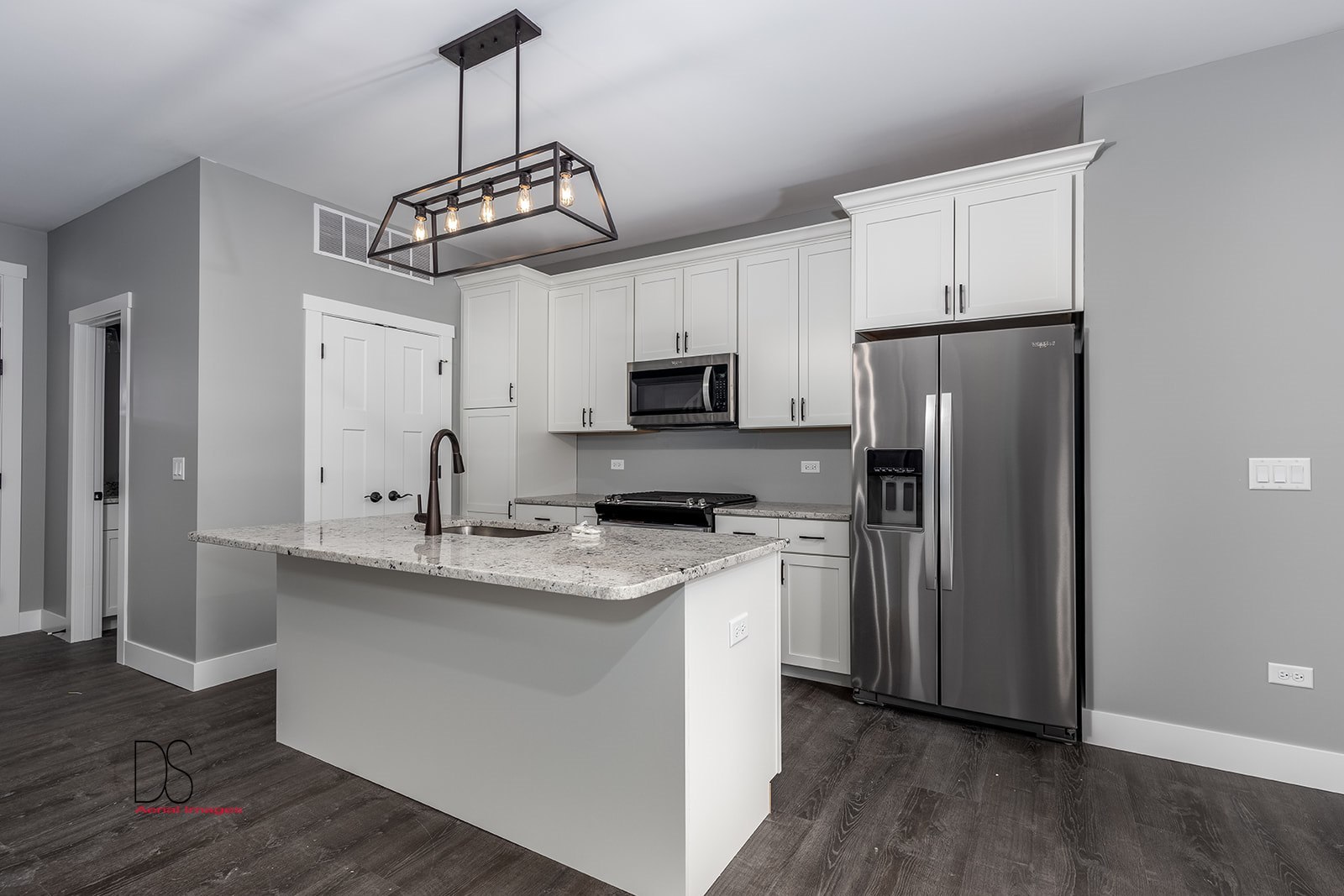100 Great Loop E Drive, Unit 54 Ottawa, IL 61350 - Photo 4 of 14 a kitchen with stainless steel appliances granite countertop a stove a refrigerator and a sink