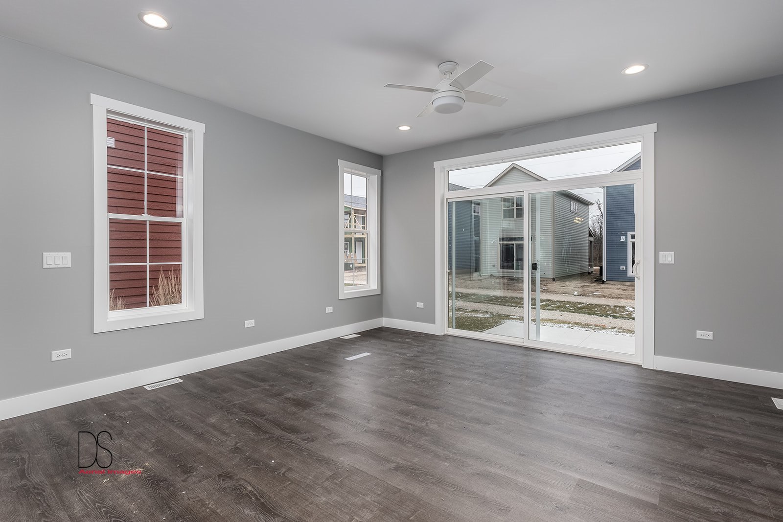 100 Great Loop E Drive, Unit 54 Ottawa, IL 61350 - Photo 5 of 14 an empty room with wooden floor and windows