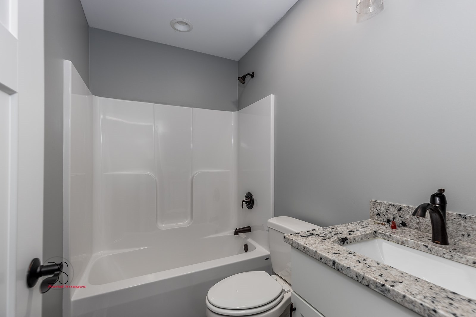 100 Great Loop E Drive, Unit 54 Ottawa, IL 61350 - Photo 7 of 14 a bathroom with a granite countertop sink toilet and shower