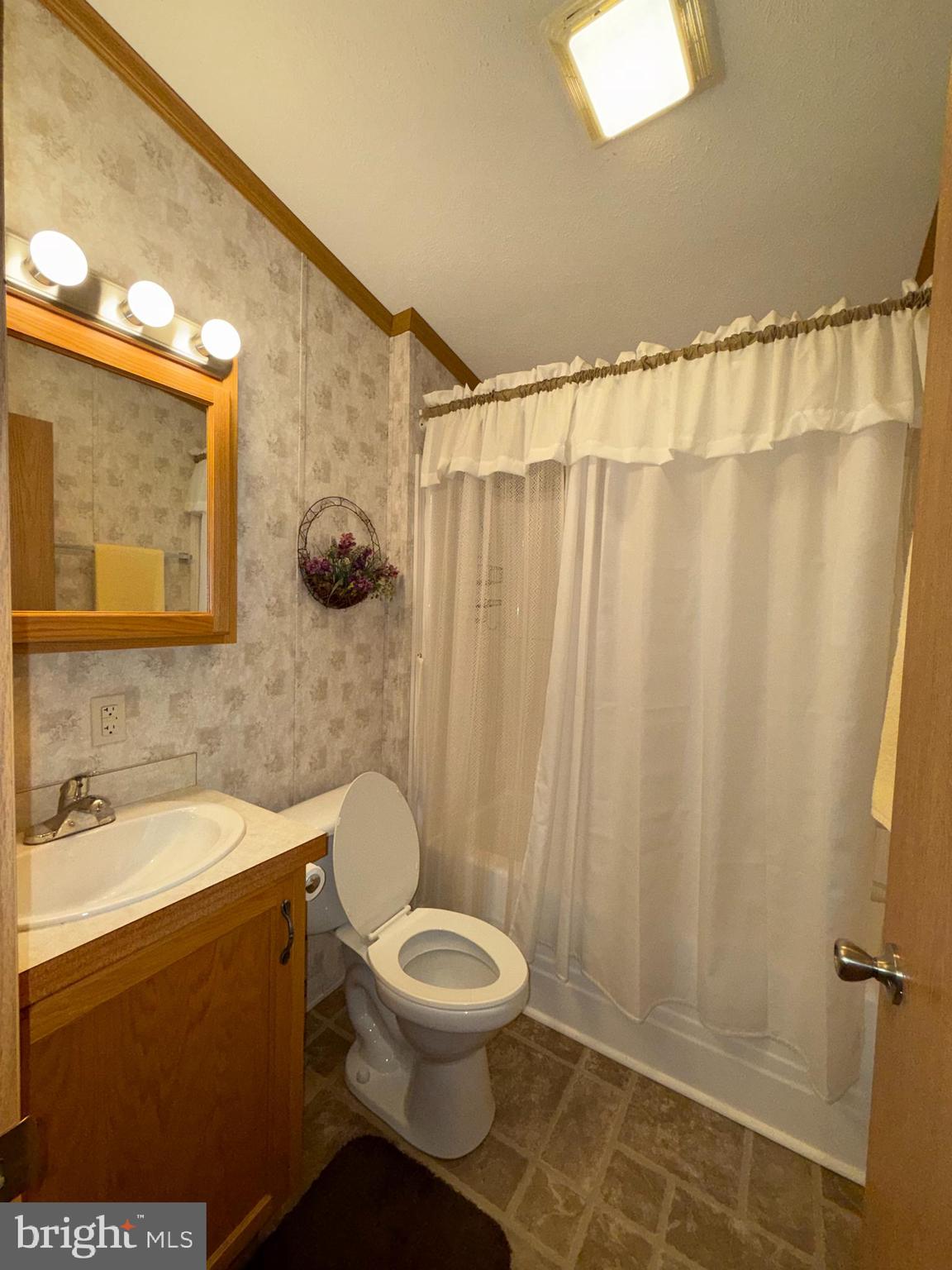 21 Dogwood East Tabernacle, NJ 08088 - Photo 11 of 12 a bathroom with a toilet a sink and a shower