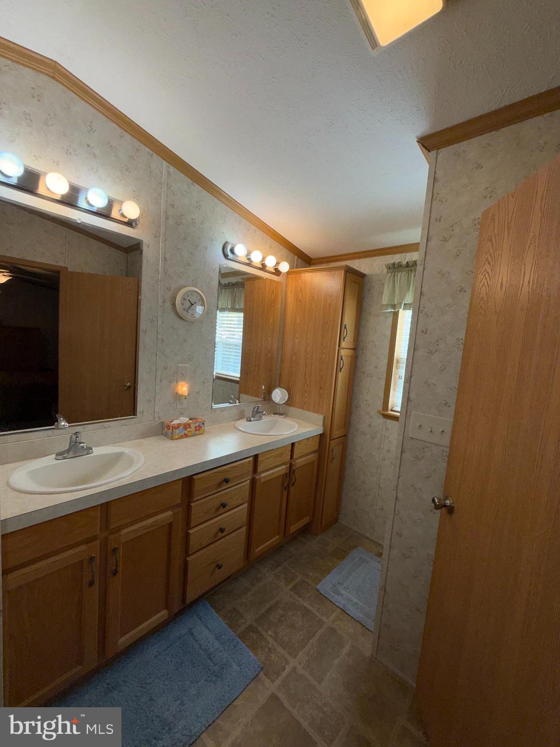 21 Dogwood East Tabernacle, NJ 08088 - Photo 10 of 12 a spacious bathroom with a double vanity sink a large mirror and a shower