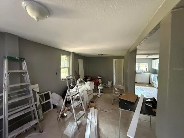 a view of a livingroom with furniture and window