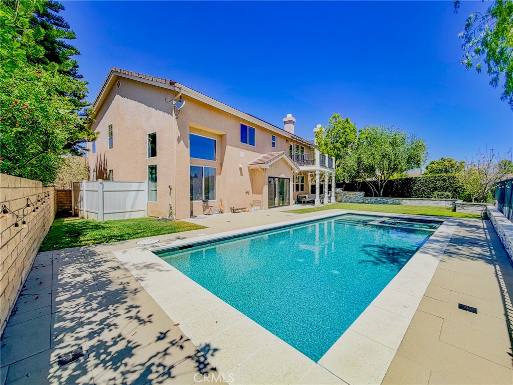25714 Wallace Place Stevenson Ranch, CA 91381 - Photo 21 of 24 a view of a house with a swimming pool