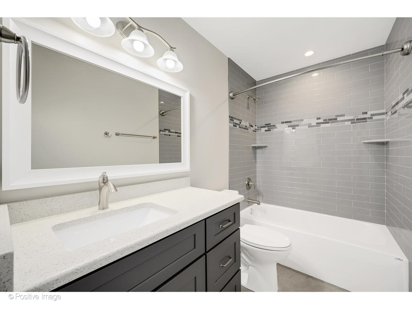 1120 Grant Street Wheaton, IL 60189 - Photo 12 of 17 a bathroom with a sink a toilet and shower