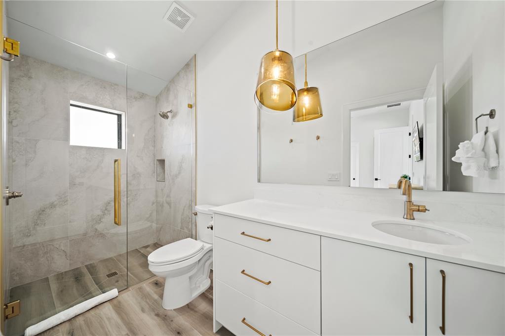 7007 Point Of Rocks Road Sarasota, FL 34242 - Photo 42 of 62 a bathroom with a sink a toilet and shower