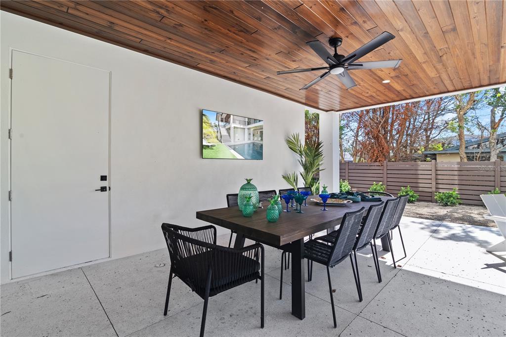 7007 Point Of Rocks Road Sarasota, FL 34242 - Photo 54 of 62 a view of an outside dining space with furniture