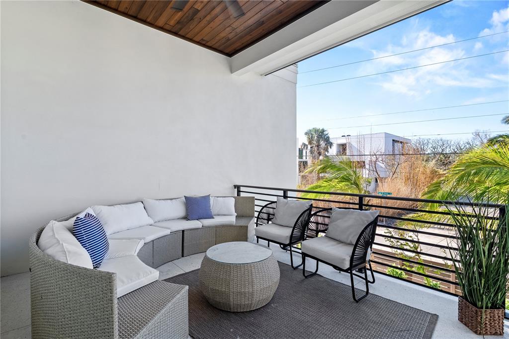 7007 Point Of Rocks Road Sarasota, FL 34242 - Photo 61 of 62 a balcony with couple of chairs and a wooden floor