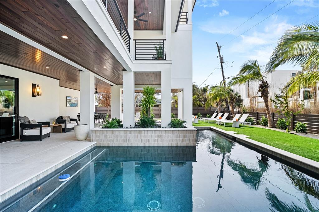 7007 Point Of Rocks Road Sarasota, FL 34242 - Photo 8 of 62 a view of swimming pool with outdoor seating and plants