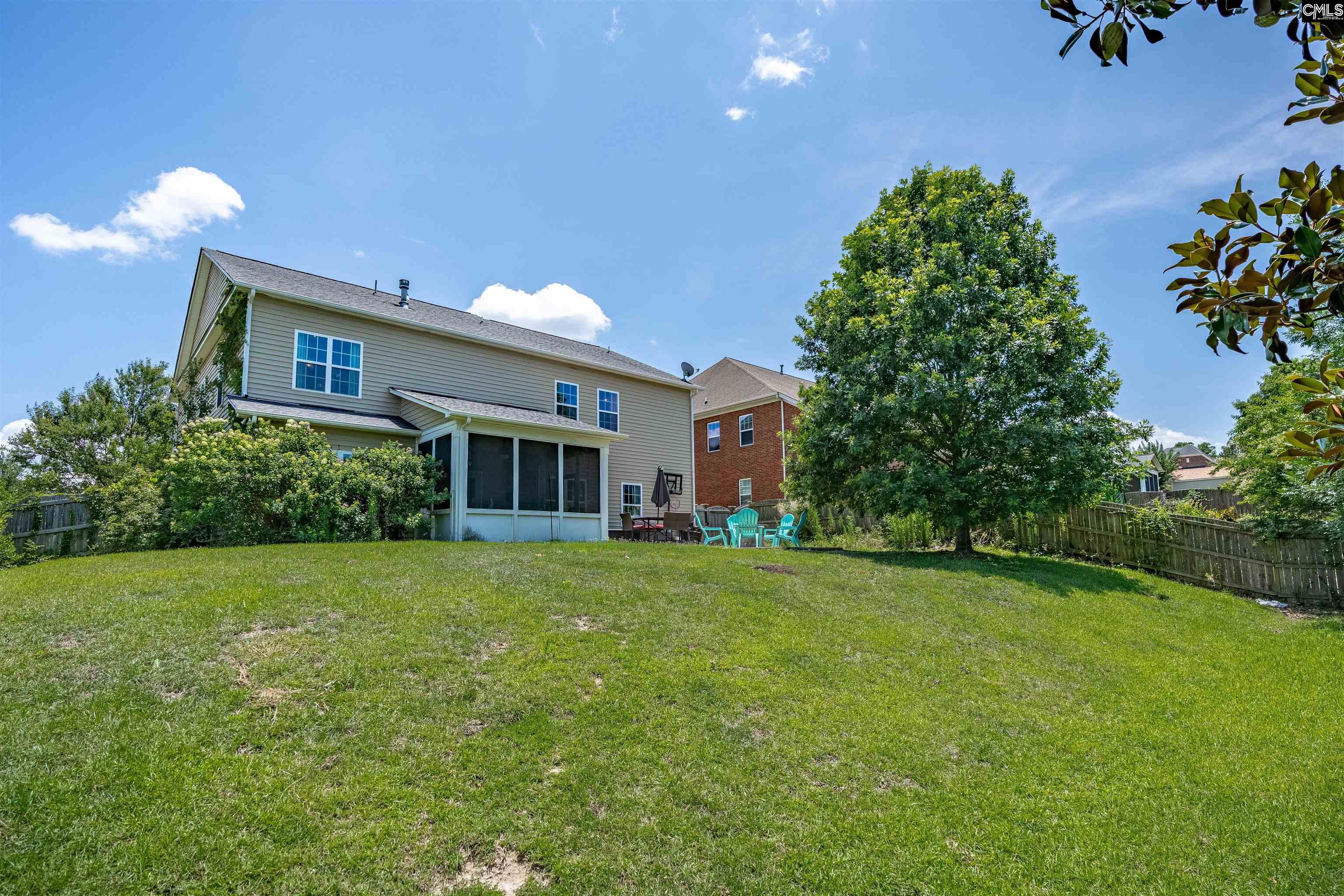 321 Asa Rose Lexington, SC 29072 - Photo 45 of 52 a front view of a house with a garden