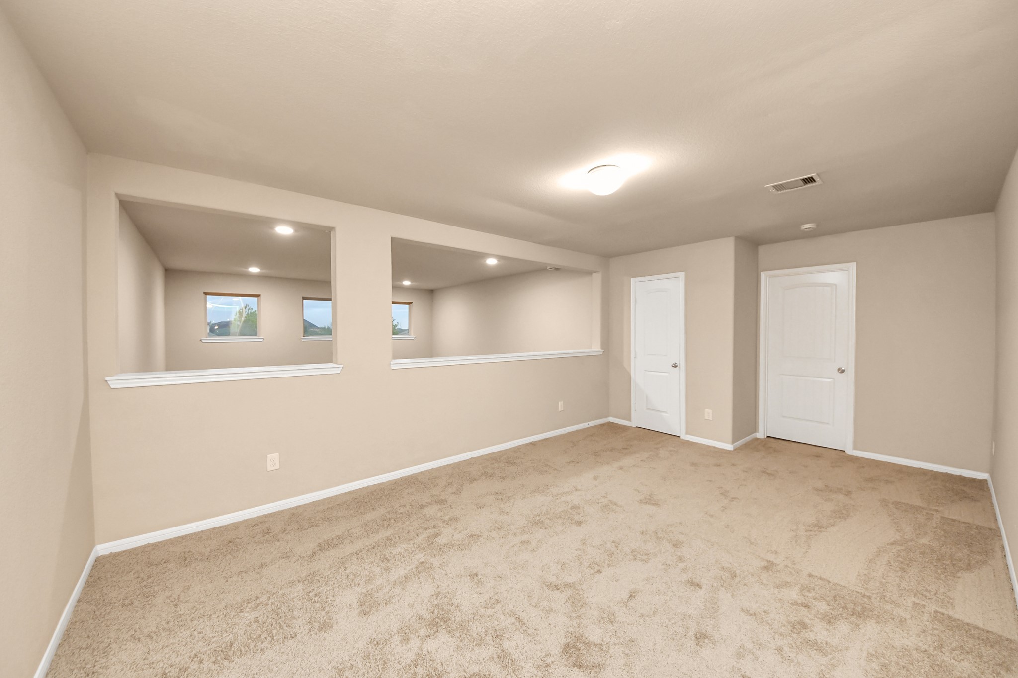 9326 Limestone Ranch Lane Richmond, TX 77407 - Photo 14 of 50 an empty room with a white wall & windows