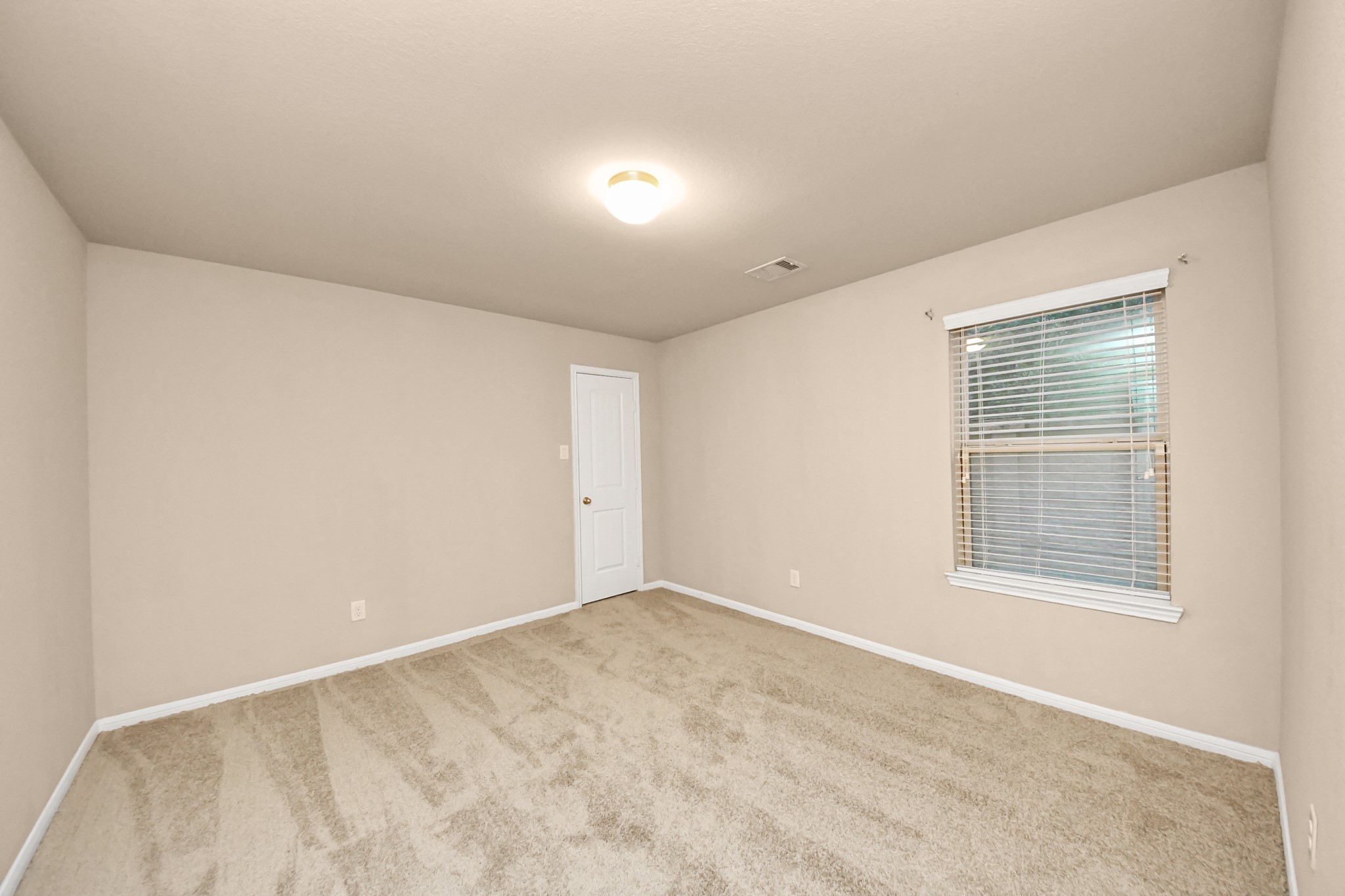9326 Limestone Ranch Lane Richmond, TX 77407 - Photo 24 of 50 a view of an empty room with a window