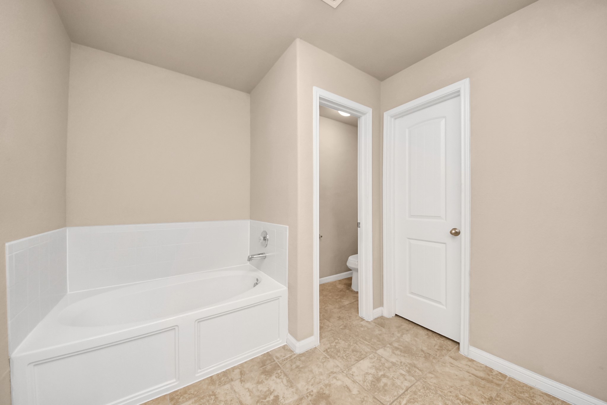 9326 Limestone Ranch Lane Richmond, TX 77407 - Photo 44 of 50 a bathroom with a bathtub and a shower