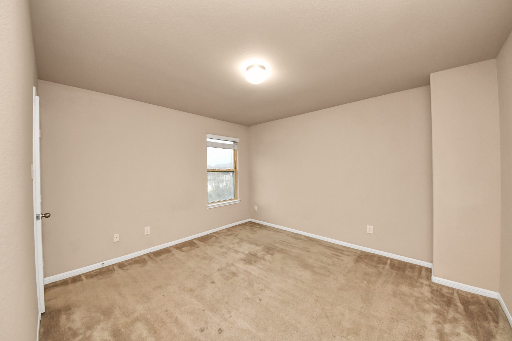 9326 Limestone Ranch Lane Richmond, TX 77407 - Photo 7 of 50 a view of an empty room with a window