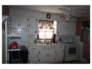 407 Florida Grove Road Perth Amboy, NJ 08861 - Photo 1 of 9 a kitchen with cabinets and window