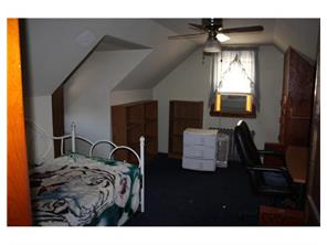 407 Florida Grove Road Perth Amboy, NJ 08861 - Photo 2 of 9 a bedroom with bed and window