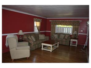 407 Florida Grove Road Perth Amboy, NJ 08861 - Photo 3 of 9 a living room with furniture and a wooden floor