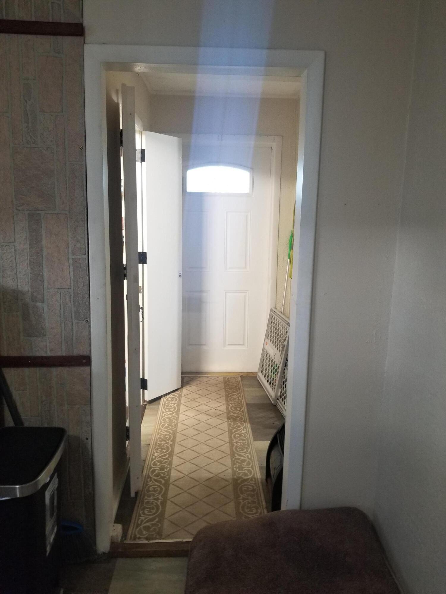 1224 Raymond Avenue Fort Pierce, FL 34950 - Photo 15 of 27 a view of hallway with mirror