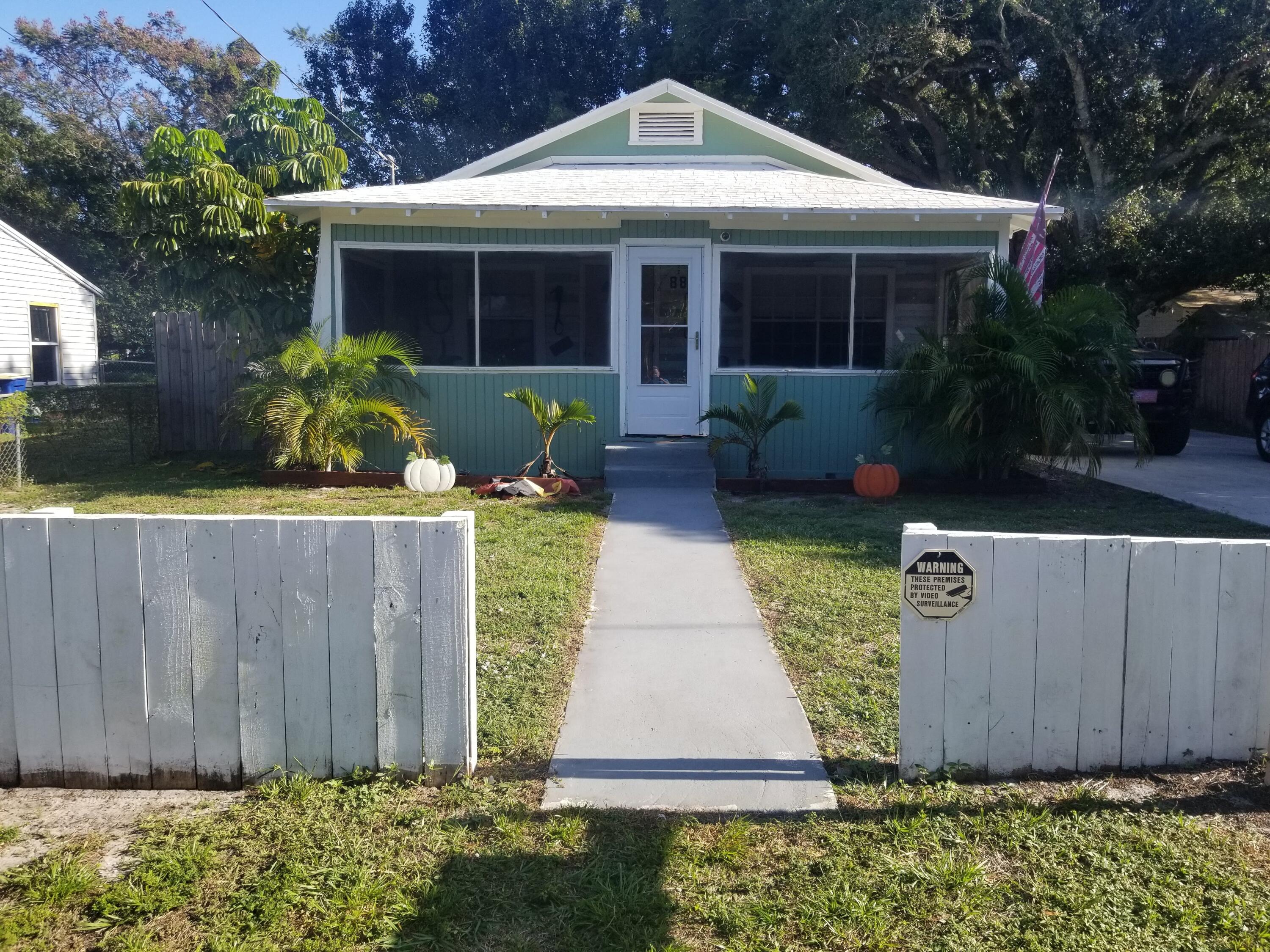 1224 Raymond Avenue Fort Pierce, FL 34950 - Photo 2 of 27 a front view of house with garden