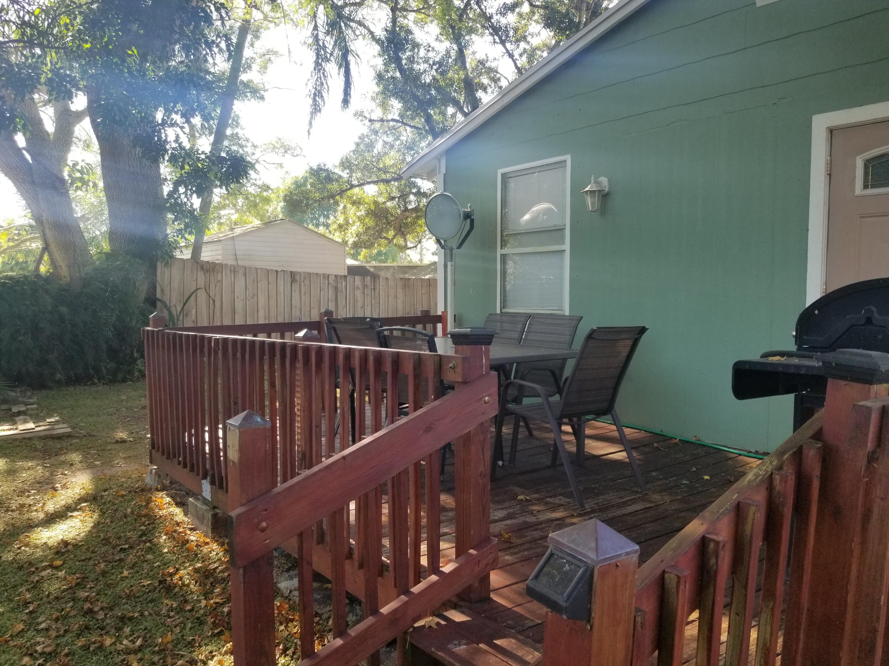 1224 Raymond Avenue Fort Pierce, FL 34950 - Photo 22 of 27 a view of balcony with outdoor seating and wooden floor