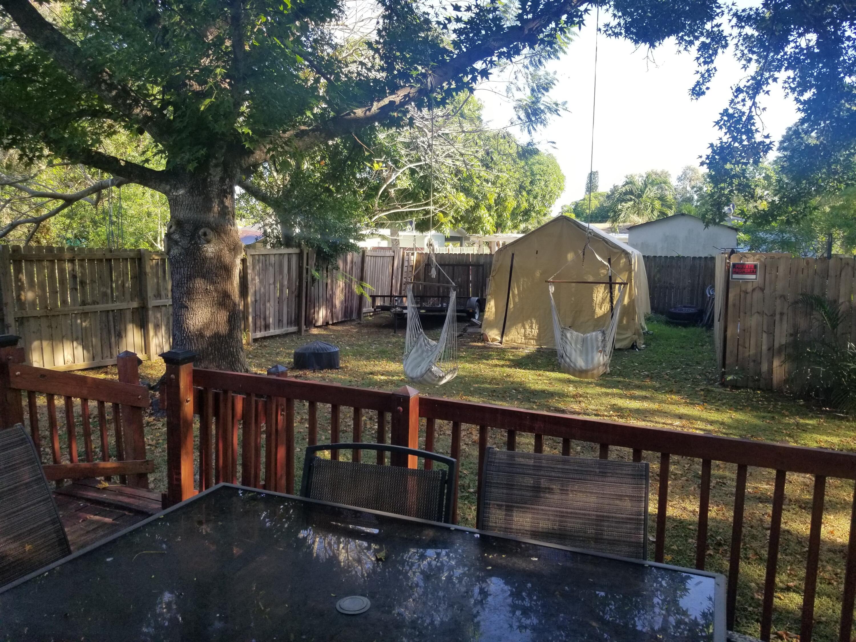 1224 Raymond Avenue Fort Pierce, FL 34950 - Photo 23 of 27 a view of a wooden deck and a backyard