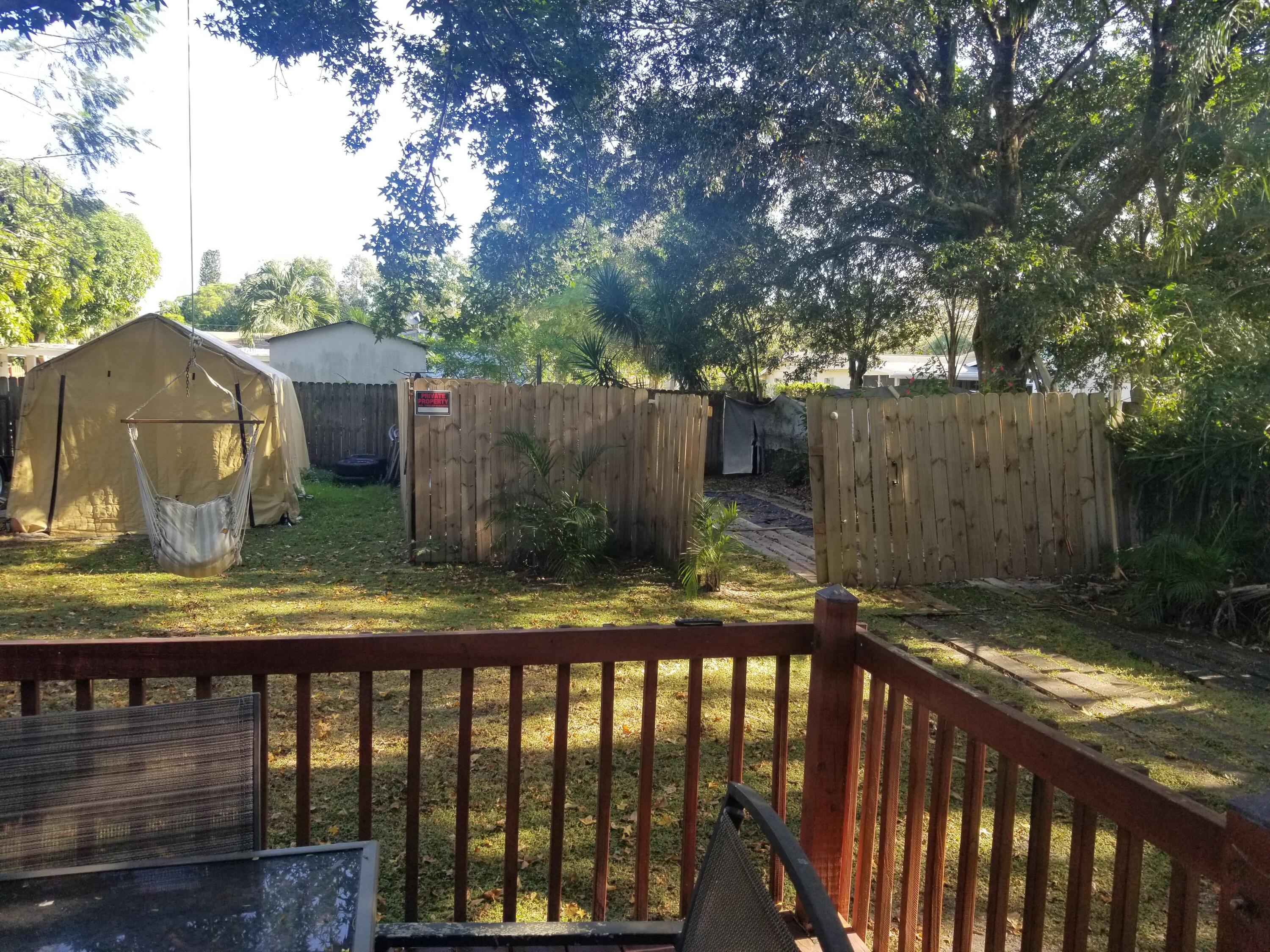 1224 Raymond Avenue Fort Pierce, FL 34950 - Photo 24 of 27 a view of a wooden fence next to a yard
