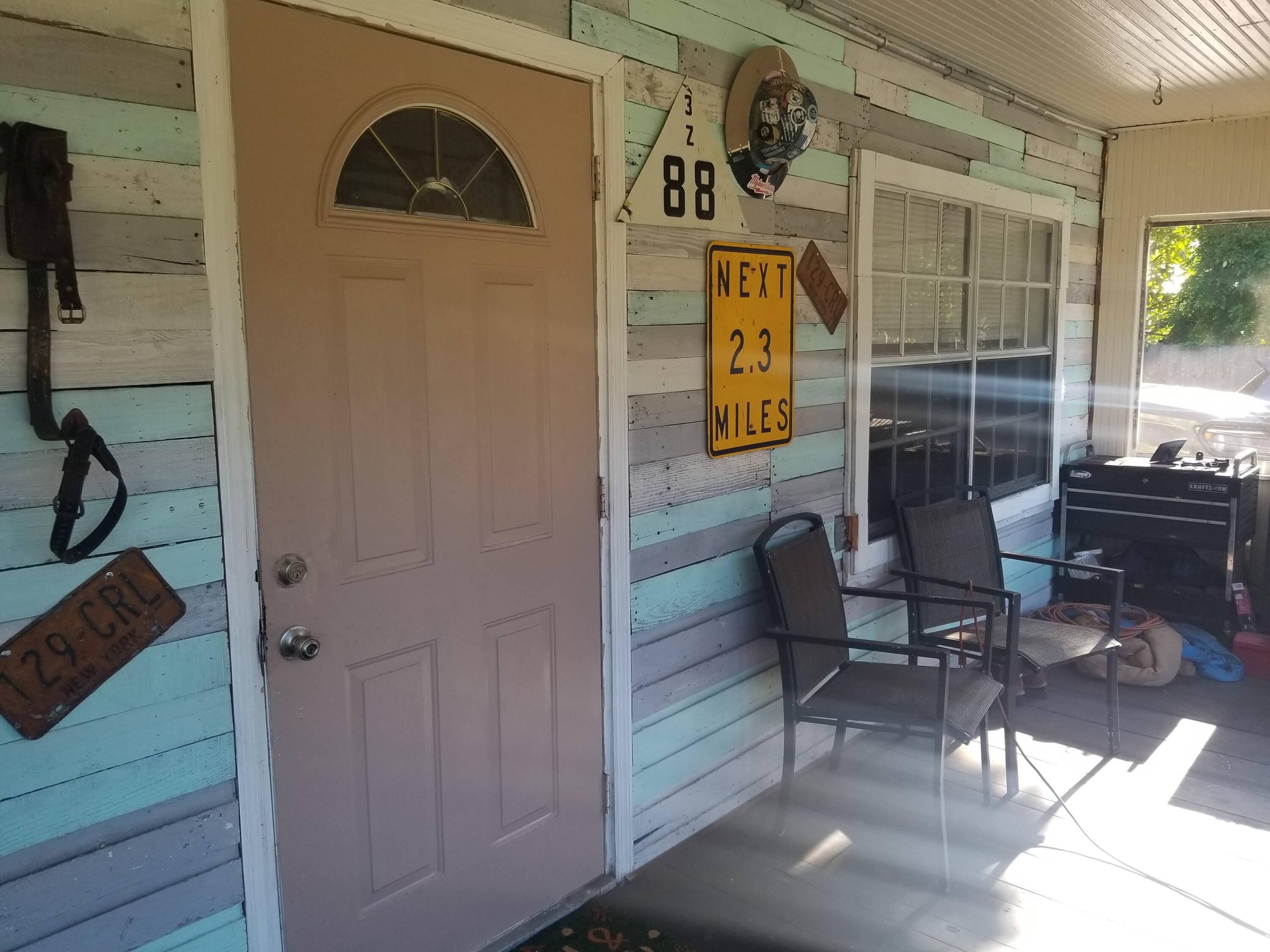 1224 Raymond Avenue Fort Pierce, FL 34950 - Photo 3 of 27 a view of a door and chair in the balcony