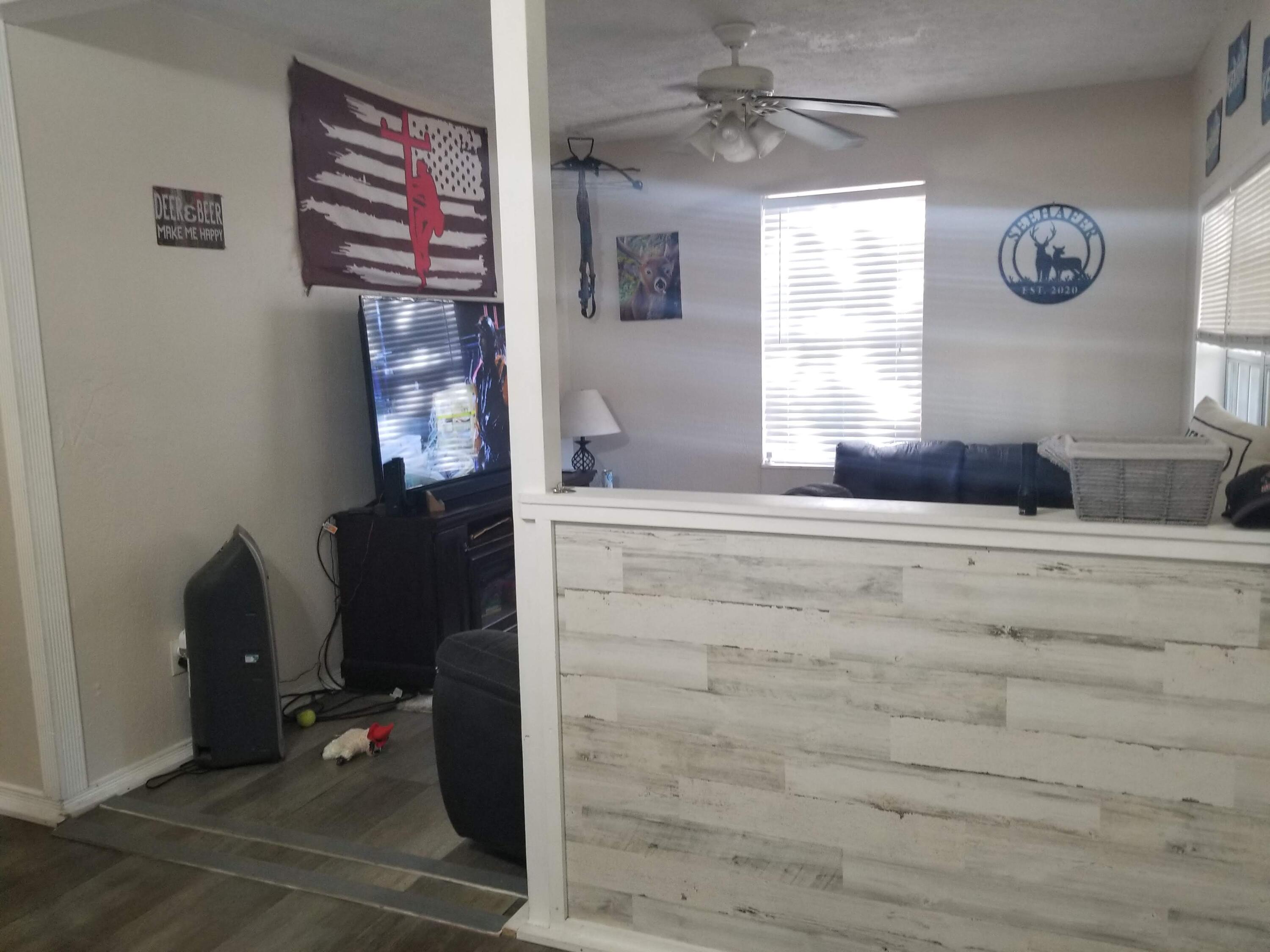 1224 Raymond Avenue Fort Pierce, FL 34950 - Photo 5 of 27 a bedroom with a bed and a window