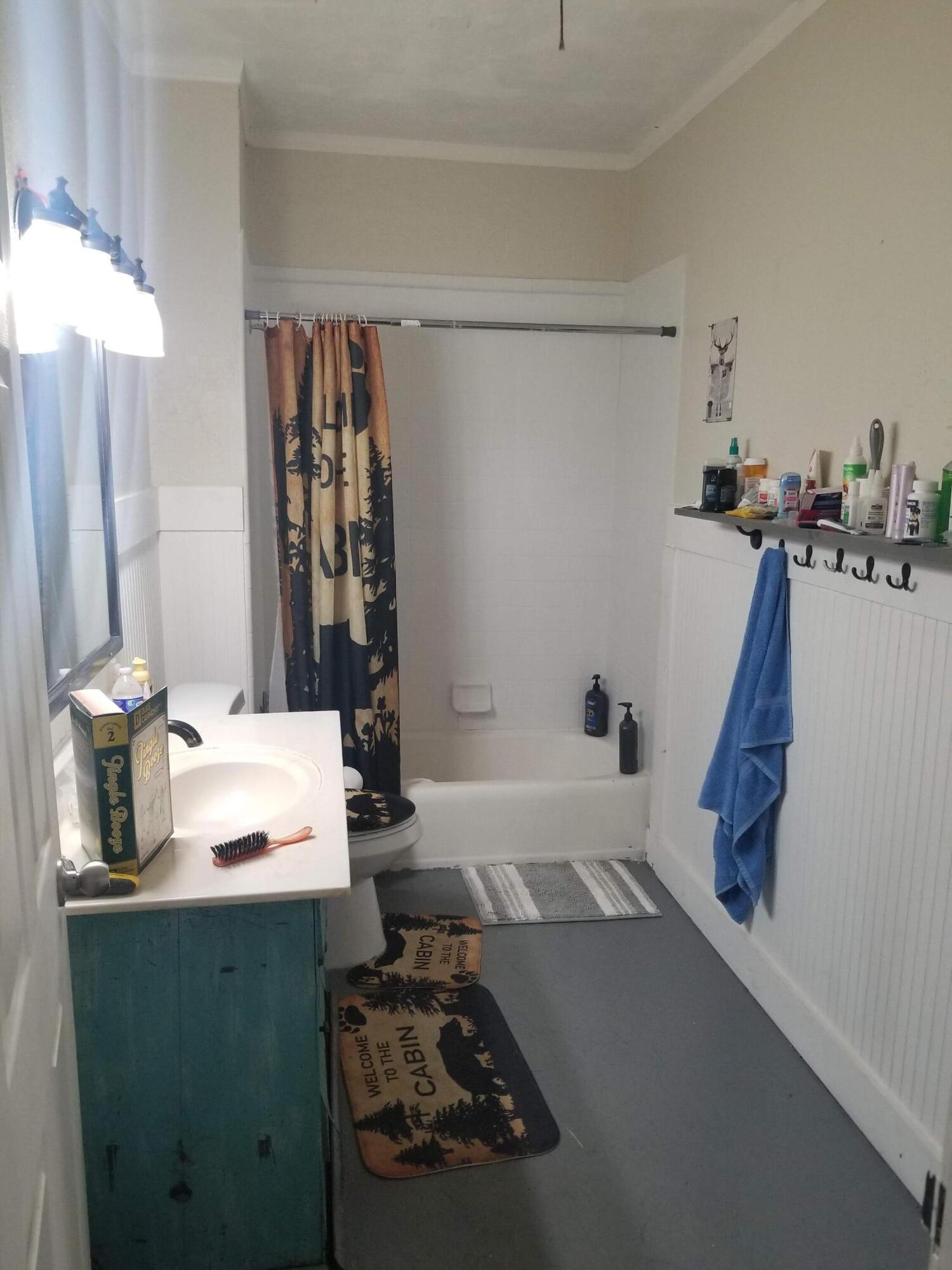 1224 Raymond Avenue Fort Pierce, FL 34950 - Photo 8 of 27 a bathroom with a sink and a mirror