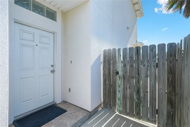 a view of a bathroom with glass door and shower