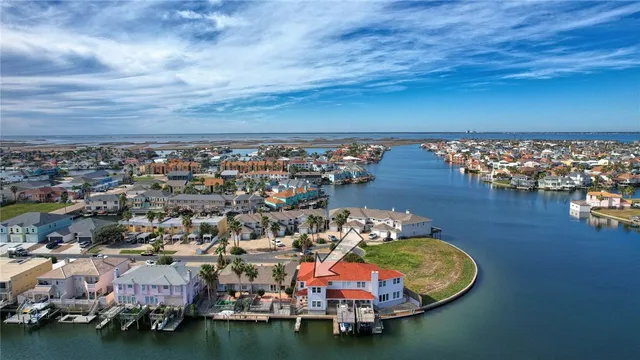 an aerial view of a house with a ocean view