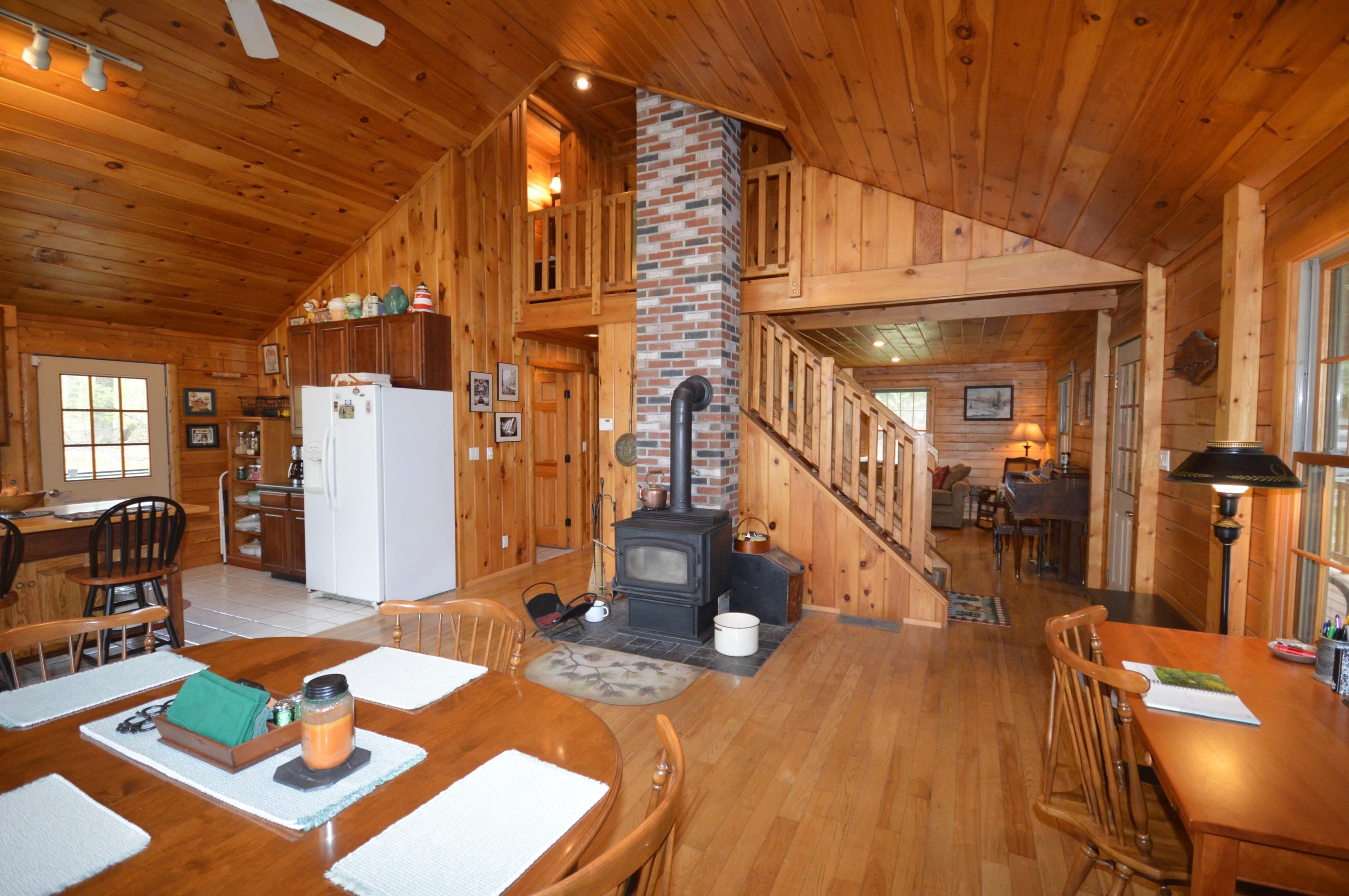 213 Mills Road Exeter, ME 04435 - Photo 40 of 41 Wood stove, open floor plan