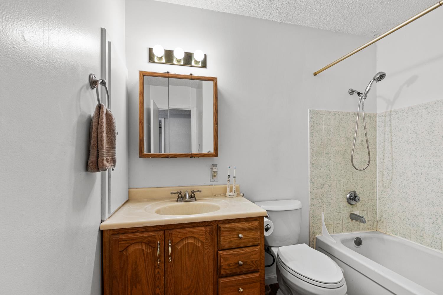 4329 Zephyr Way Sacramento, CA 95821 - Photo 12 of 44 a bathroom with a sink a toilet and shower