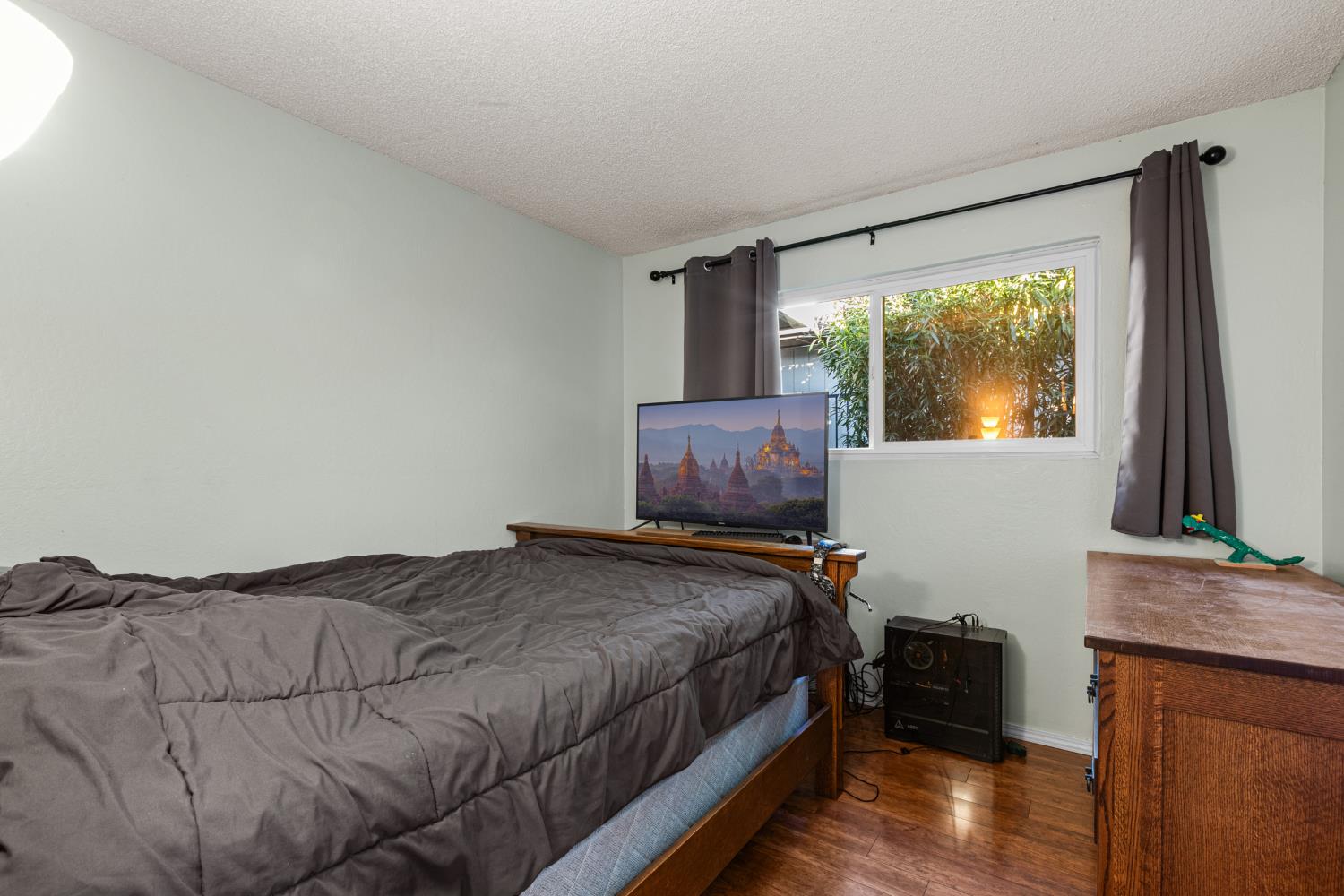 4329 Zephyr Way Sacramento, CA 95821 - Photo 13 of 44 a bedroom with a bed and wooden floor
