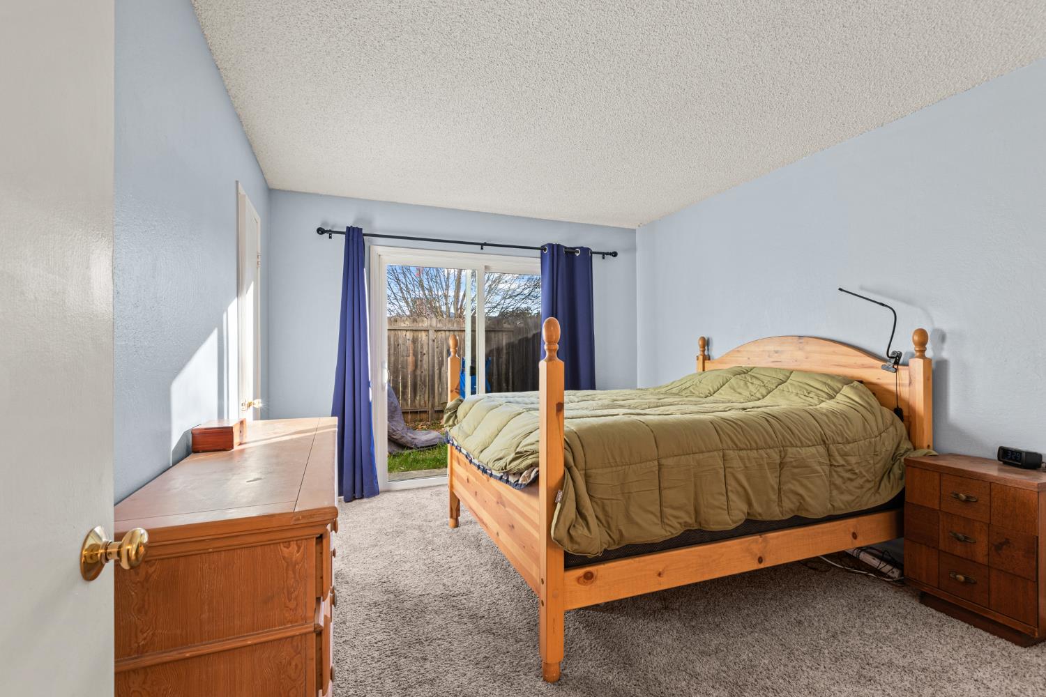 4329 Zephyr Way Sacramento, CA 95821 - Photo 16 of 44 a bed sitting in a bedroom next to a window