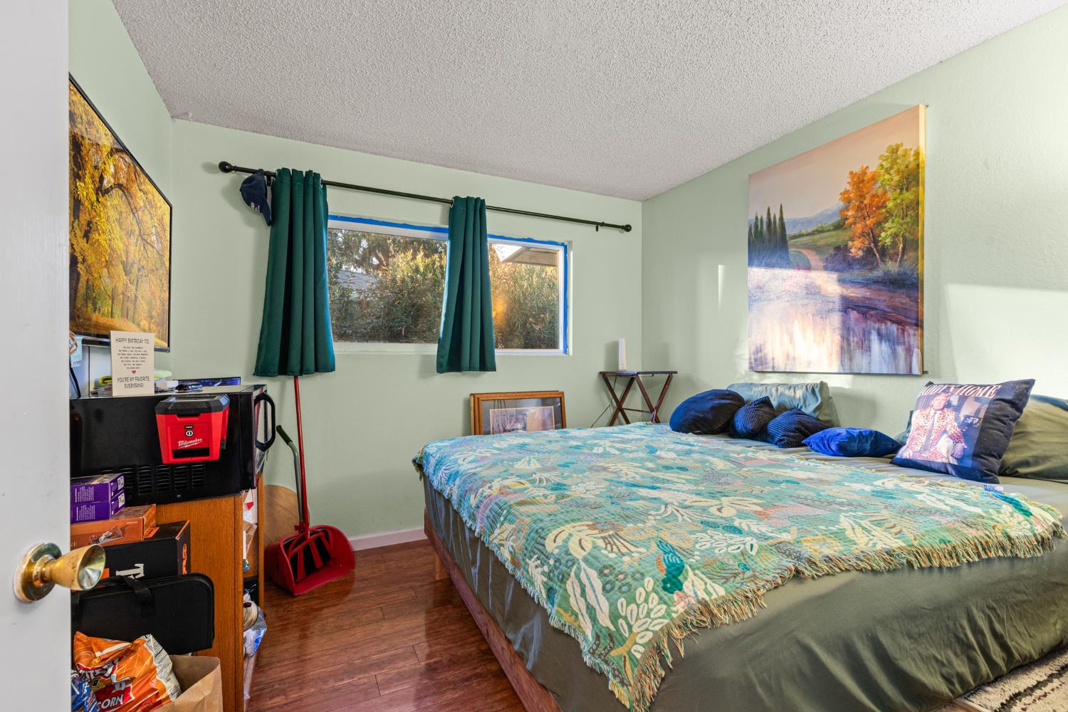 4329 Zephyr Way Sacramento, CA 95821 - Photo 29 of 44 a bedroom with a bed and wooden floor