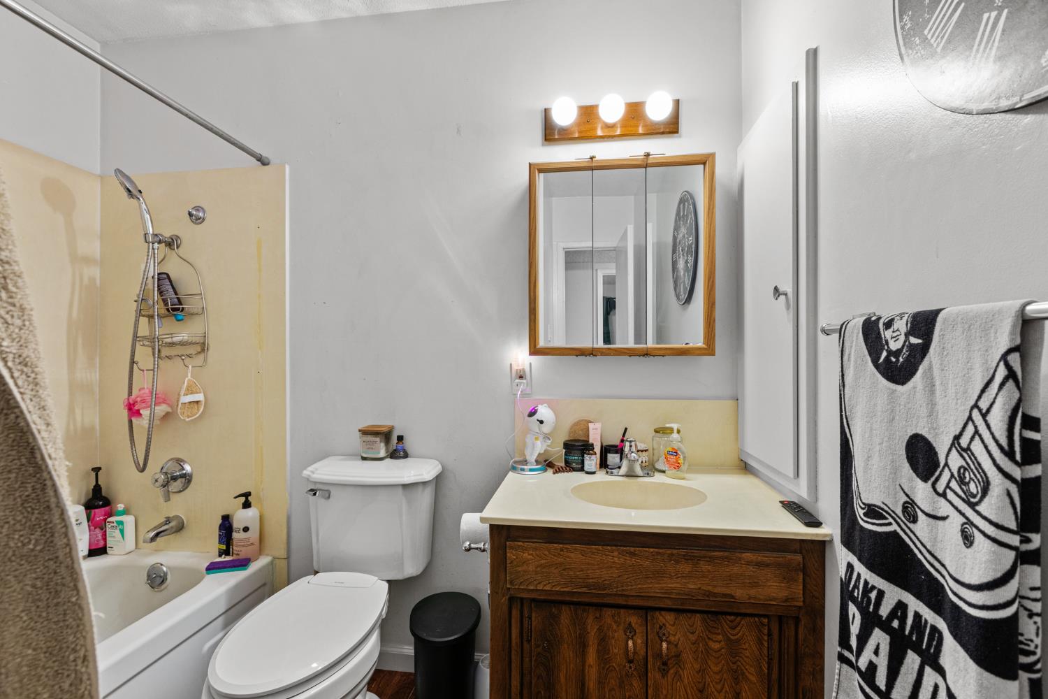 4329 Zephyr Way Sacramento, CA 95821 - Photo 30 of 44 a bathroom with a sink toilet and shower curtain