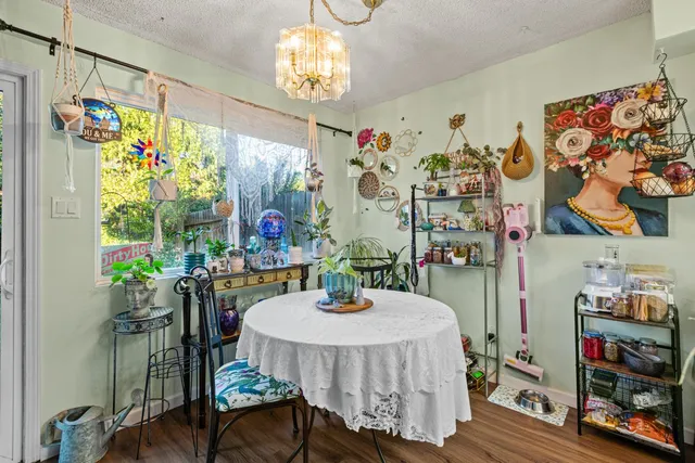 a dining room with furniture and chandelier
