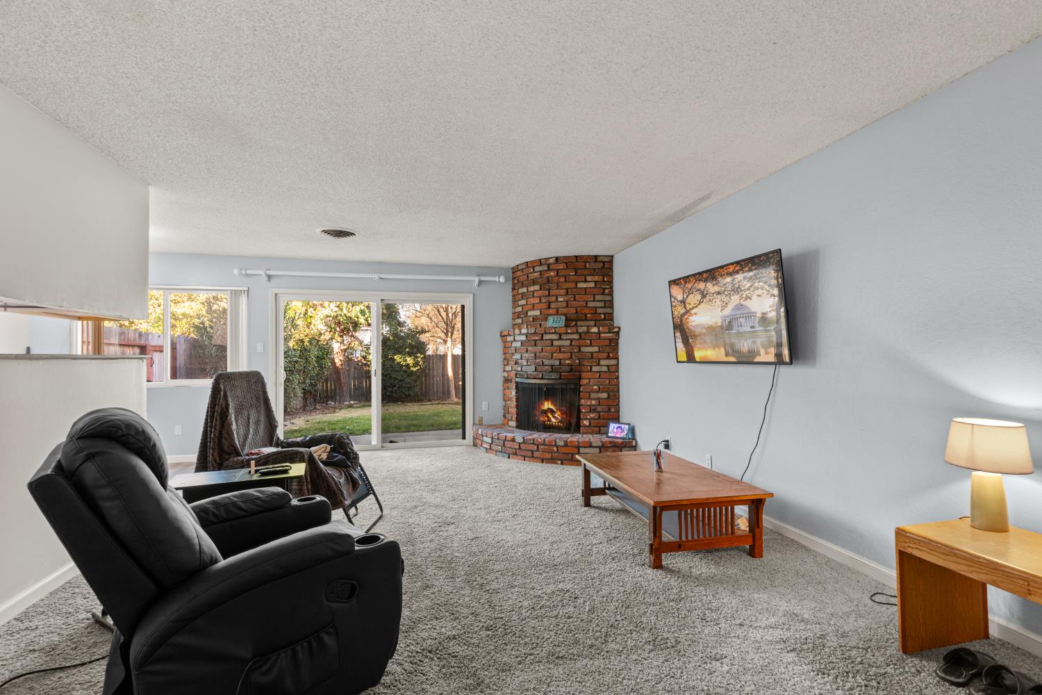 4329 Zephyr Way Sacramento, CA 95821 - Photo 6 of 44 a living room with furniture a large window and a flat screen tv