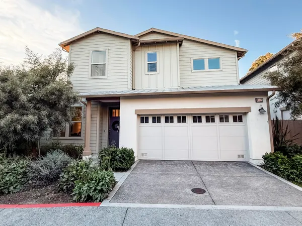 a front view of a house with garage