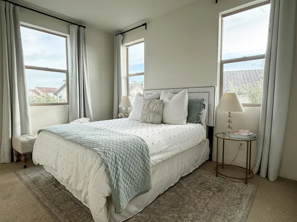 a bedroom with a bed and window