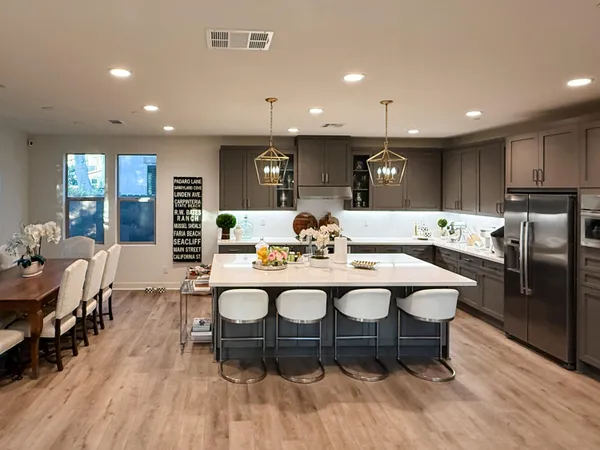 a kitchen with a table and chairs