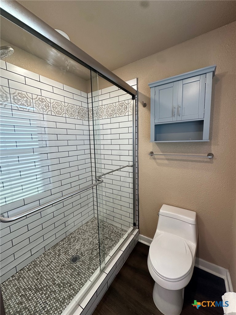 952 Fannin Loop Temple, TX 76501 - Photo 14 of 15 a bathroom with a toilet and a shower