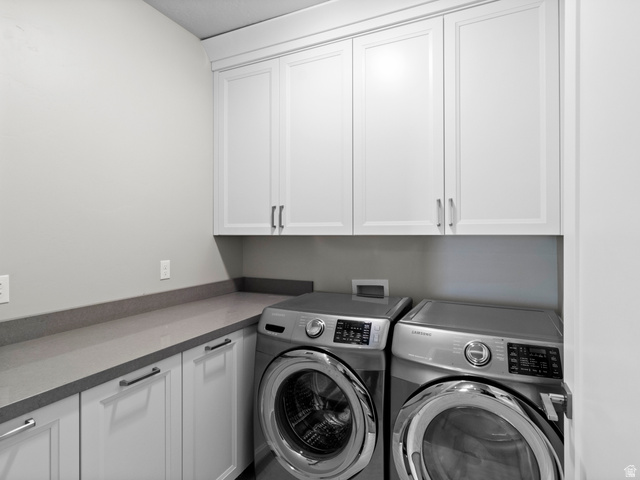 614 East High Lane Alpine, UT 84004 - Photo 58 of 75 Laundry area with washer and dryer and cabinet space