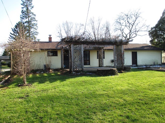 4718 Highcrest Road Rockford, IL 61107 - Photo 20 of 20 a view of a house with backyard and sitting area