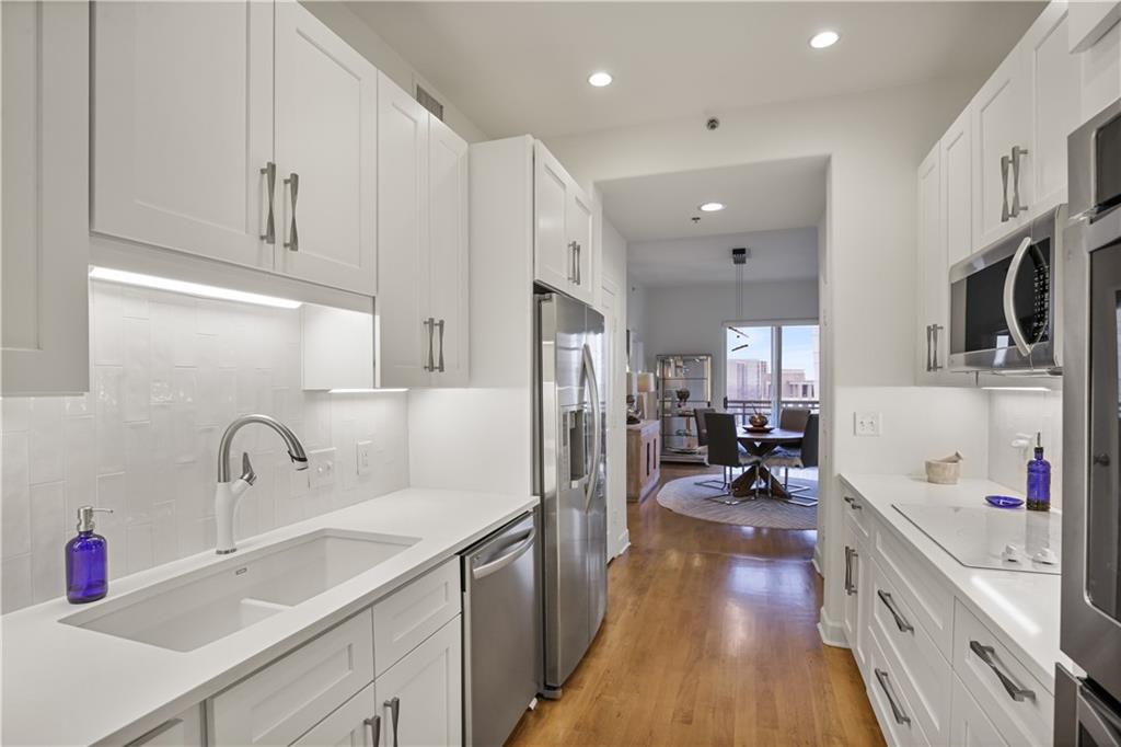 3445 Stratford Road Northeast, Unit 3703 Atlanta, GA 30326 - Photo 15 of 59 a kitchen with cabinets a sink and appliances