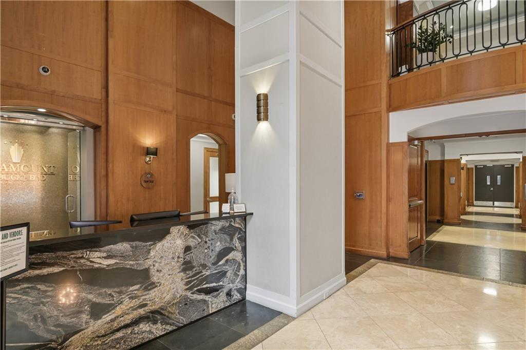 3445 Stratford Road Northeast, Unit 3703 Atlanta, GA 30326 - Photo 46 of 59 a bathroom with a granite countertop sink and a mirror